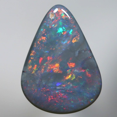 SOLID SEMI BLACK OPAL Sparkles of fire red and orange over blue green